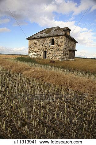 Stock Image -  house abandoned stone in scenic deserted empty . Fotosearch