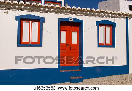 Stock Image -  house colorful red door in beautiful algarve . Fotosearch