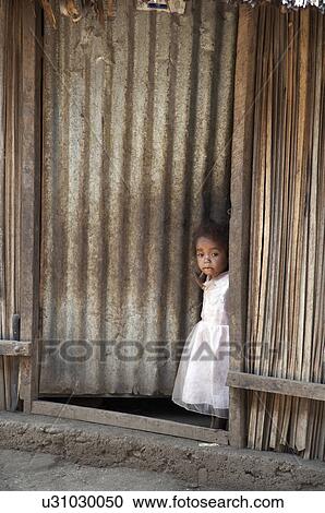 Stock Image -  house girl child children timor leste aosera out. Fotosearch
