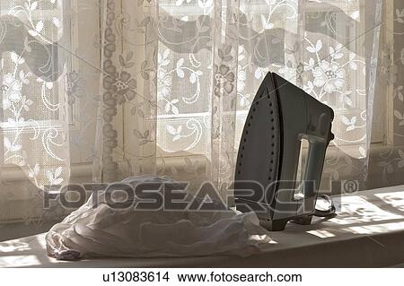 house home ironing iron irons laundry chores View Large Photo Image Picture - house home ironing iron irons laundry chores . Fotosearch