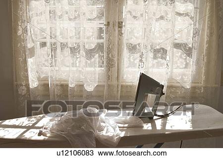 house home ironing iron irons laundry chores View Large Photo Image Stock Image - house home ironing iron irons laundry chores . Fotosearch