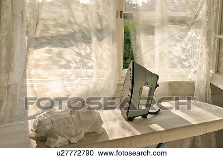 Stock Image -  house home ironing iron irons laundry chores . Fotosearch