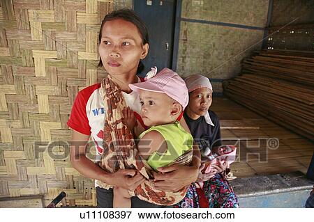 Stock Photo - indonesia, ciputat, village, sunda, west, java, women, baby. Fotosearch
