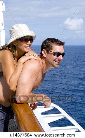 Picture -  love couple relaxing happy aged 40s in holiday. Fotosearch
