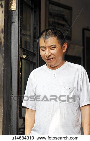 man chinese male in doorway beijing china asia View Large Photo Image Stock Image - man chinese male in doorway beijing china asia . Fotosearch