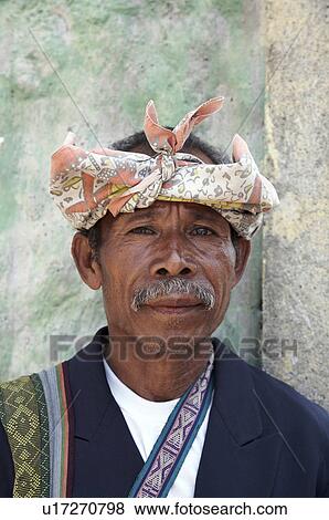 Stock Photo -  man face timor leste old wearing dress including. Fotosearch