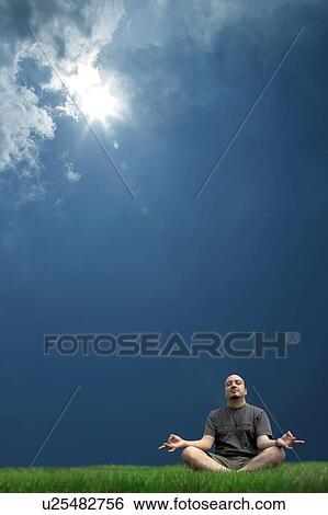 Stock Photograph -  man person 25-30 years 30-35 bliss blissful calm. Fotosearch
