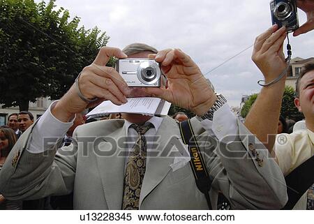 man technology male taking digital photos View Large Photo Image Stock Photography - man technology male taking digital photos . Fotosearch
