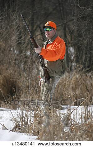 man upland bird hunter standing ready in snow man View Large Photo Image Stock Image - man upland bird hunter standing ready in snow man. Fotosearch