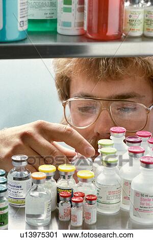 medical man person 35-40 years blonde bottles View Large Photo Image Stock Image - medical man person 35-40 years blonde bottles. Fotosearch
