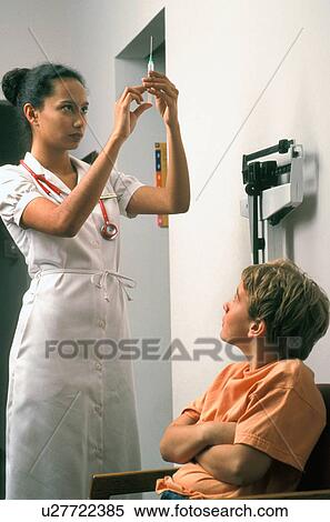 Stock Photography -  medical woman child 10-12 years 25-30 afraid care. Fotosearch