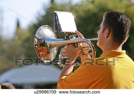 Stock Photo -  music mellophone player in band teenager music . Fotosearch