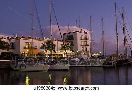 Stock Photography -  night time exposure beautiful harbor port mogan. Fotosearch