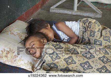 Stock Image -  people child children timor leste camp for idps. Fotosearch