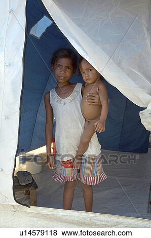 Stock Photo -  people child children timor leste camp for idps. Fotosearch