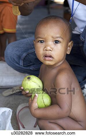 Stock Photo -  people child children timor leste camp for idps. Fotosearch