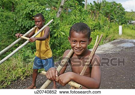 Stock Image -  people child person children fiji boys playing . Fotosearch
