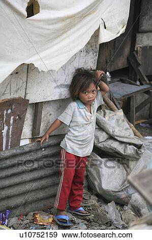 Stock Photo -  people child person children living shantytown. Fotosearch