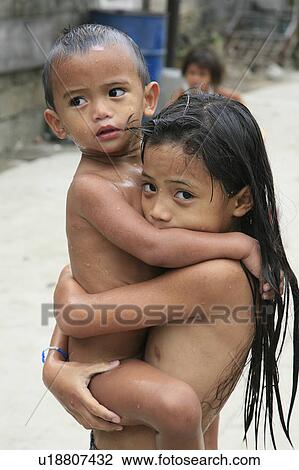 Stock Image -  people child person children playing street slum . Fotosearch