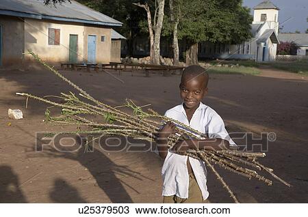 Stock Image -  people child person children tanzania boy sticks. Fotosearch