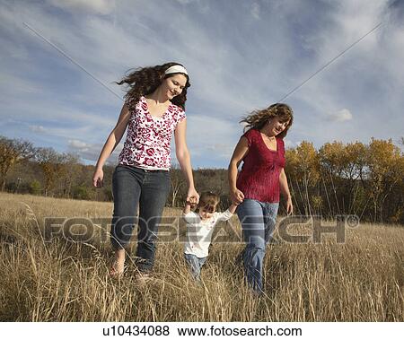 people child women two out for walk in high View Large Photo Image Stock Photo -  people child women two out for walk in high. Fotosearch