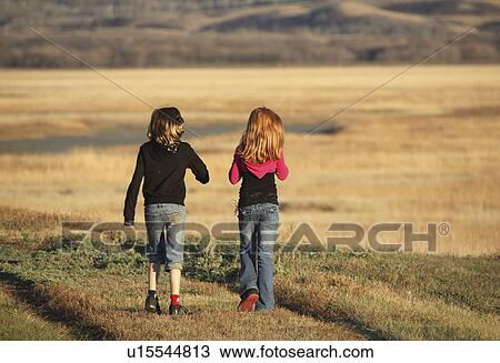 people children two girls walking causeway View Large Photo Image Stock Image - people children two girls walking causeway . Fotosearch