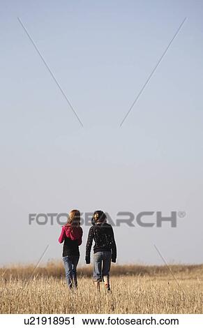 people children two girls walking causeway View Large Photo Image Stock Image - people children two girls walking causeway . Fotosearch