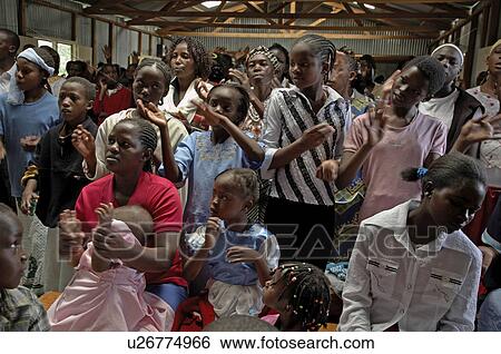 Stock Photograph -  people dance person kenya faces catholic mass . Fotosearch