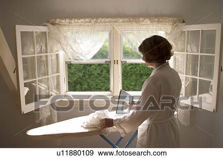 people house person home women ironing iron work View Large Photo Image Stock Photo - people house person home women ironing iron work . Fotosearch
