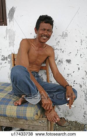 Stock Photo -  people house person indonesia tsunami survivor . Fotosearch
