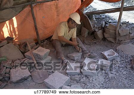 Stock Photo -  people man person chile making stone artifacts. Fotosearch