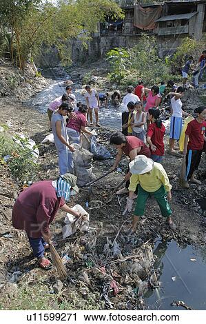 people person cleaning up filthy polluted stream View Large Photo Image Stock Image - people person cleaning up filthy polluted stream . Fotosearch