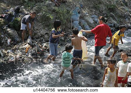 people person cleaning up filthy polluted stream View Large Photo Image Stock Photograph - people person cleaning up filthy polluted stream. Fotosearch