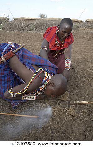 Stock Image -  people person fire kenya masai men starting way. Fotosearch