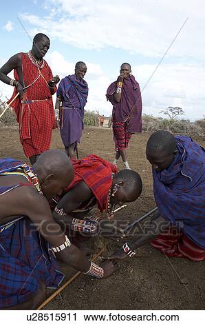 Stock Image -  people person fire kenya masai men starting way. Fotosearch