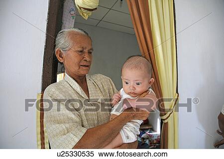 Stock Photography -  people person indonesia bab gradmother tsunami . Fotosearch
