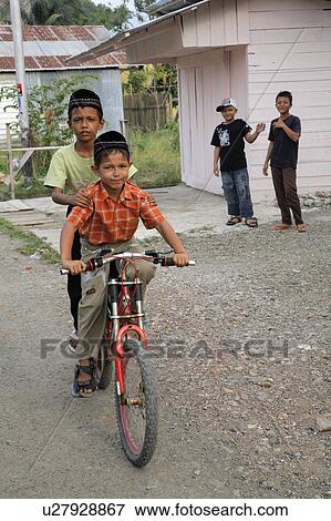 Stock Photo -  people person indonesia boys playing banda aceh . Fotosearch