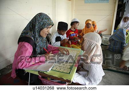 Stock Photo -  people person indonesia muslim girls koranic . Fotosearch