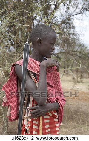 Stock Image -  people person kenya young masai boy armed spear. Fotosearch