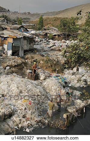 people person scavengers work garbage tip bagong View Large Photo Image Stock Photo - people person scavengers work garbage tip bagong . Fotosearch