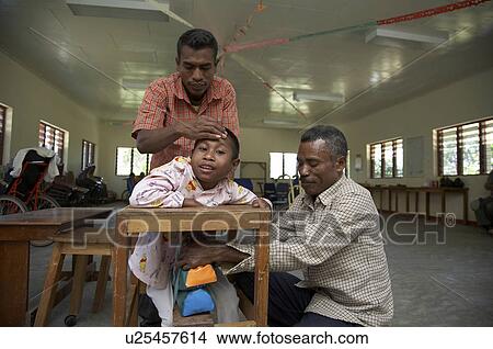 Picture -  people timor leste workshop for special needs. Fotosearch