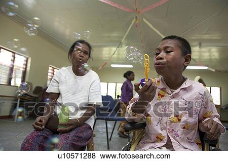 Stock Photo -  people timor leste workshop for special needs. Fotosearch