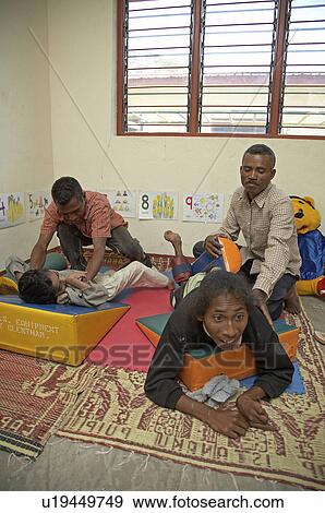 Stock Photo -  people timor leste workshop for special needs. Fotosearch