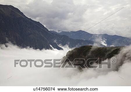 Picture -  peru mist rising in colca canyon america latin. Fotosearch