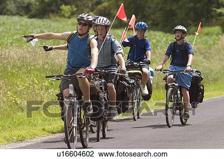 Stock Image -  summer bike riders in grand isle vt lake islands . Fotosearch