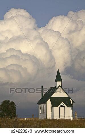 summer clouds forming behind country church View Large Photo Image Stock Image - summer clouds forming behind country church . Fotosearch