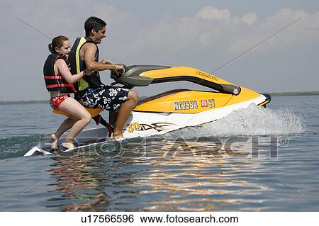 summer girl young boy riding jet ski View Large Photo Image Stock Photograph - summer girl young boy riding jet ski . Fotosearch