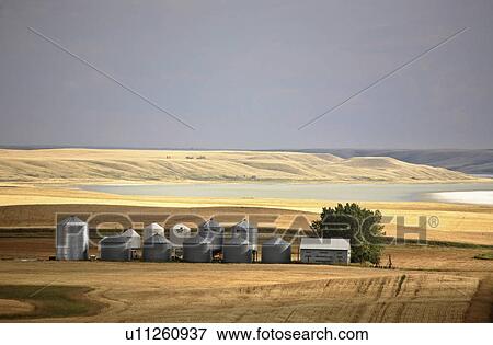 summer granaries big muddy lake in scenic cloud View Large Photo Image Stock Photo - summer granaries big muddy lake in scenic cloud . Fotosearch