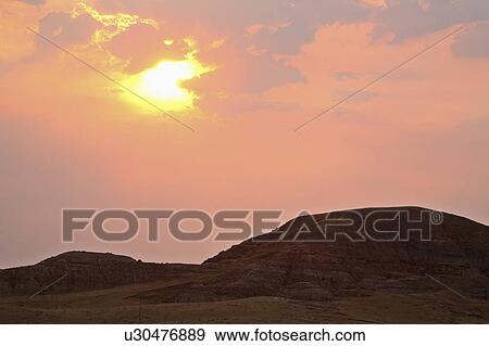 sun art rising behind thin clouds in scenic sun View Large Photo Image Stock Photo - sun art rising behind thin clouds in scenic sun . Fotosearch