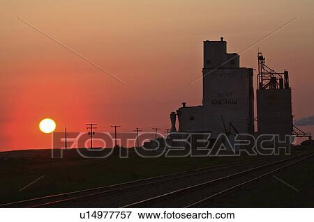 sun art setting behind eyebrow grain terminal View Large Photo Image Stock Photo - sun art setting behind eyebrow grain terminal . Fotosearch